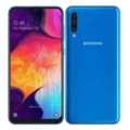 A sleek Samsung Galaxy A50 smartphone resting on a reflective surface, displaying its vibrant screen and slim design.