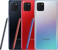 A person's hand holding a sleek Samsung Galaxy Note10 Lite with a stylus hovering over the screen.