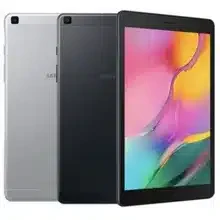 Samsung Galaxy Tab A 8.0 (2019) tablet resting on a wooden table with a cup of coffee beside it.