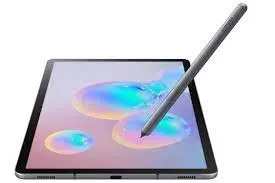 A sleek, black Samsung Galaxy Tab S6 resting on a wooden table with a stylus beside it.
