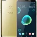 HTC Desire 12+ smartphone, black color, front view, showcasing the large 6-inch display and dual rear cameras.